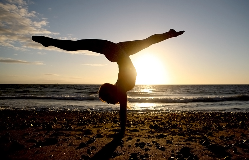 She's got some moves! Kino MacGregor practicing yoga on the Atmosphere beach at dawn in the Philippines