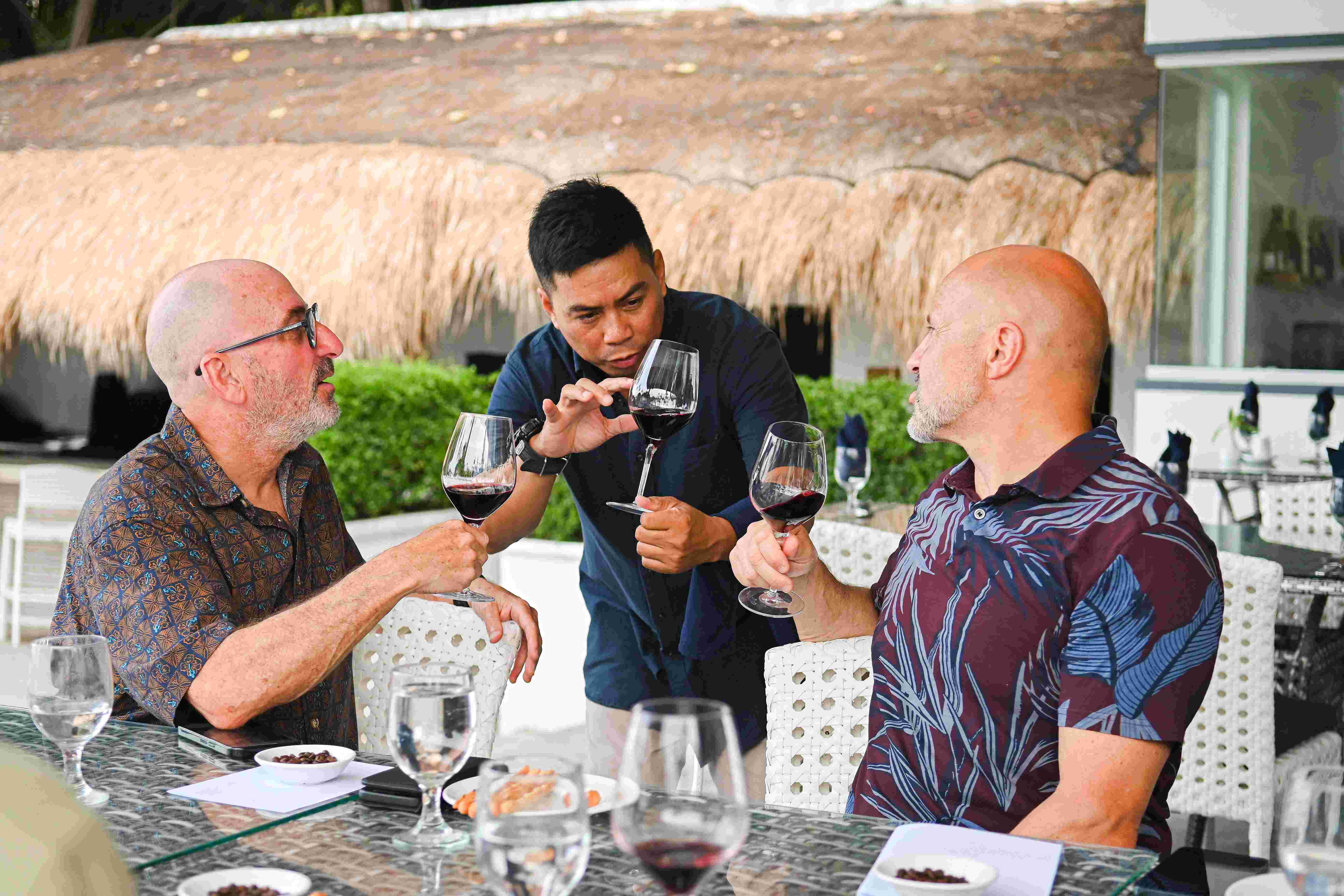 A sommelier explaining about the Wine on a wine tasting in the Philippines at Atmosphere Resorts & Spa.