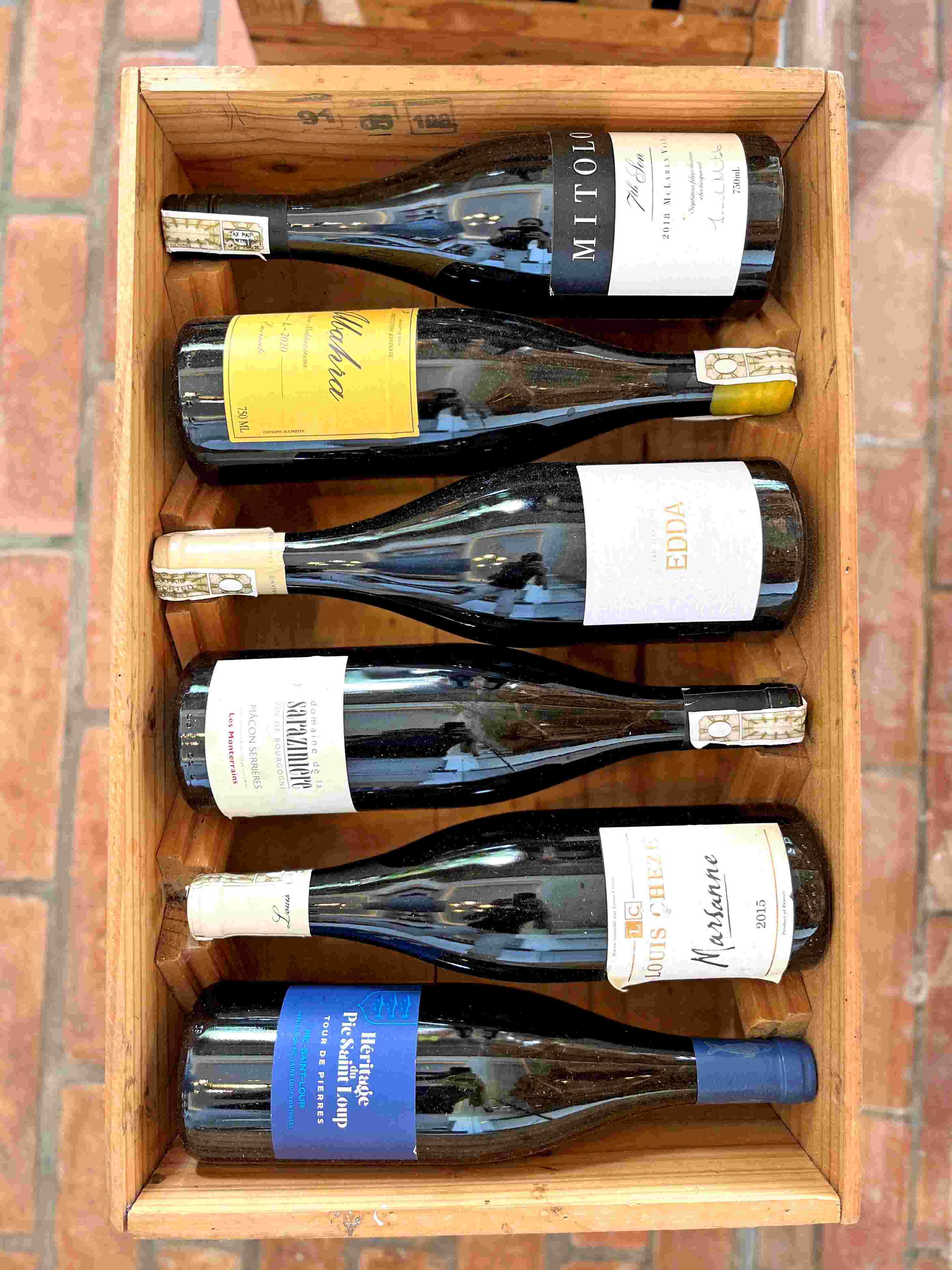 Wine bottles in a box in the Philippines at Atmosphere Resorts & Spa.